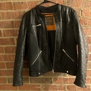 Gently used women’s XL black leather motorcycle jacket.